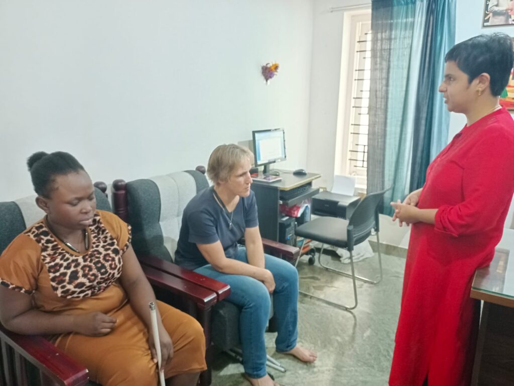 Photo showing Sabriye Tenberken, Tiffany Brar and a participant from Kanthari in the group discussion.