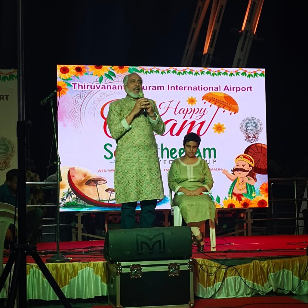 Mr.Hari Namboodiri the Chairman of World Malayalee Council,USA giving an inspiring talk and Tiffany Brar seated on stage.